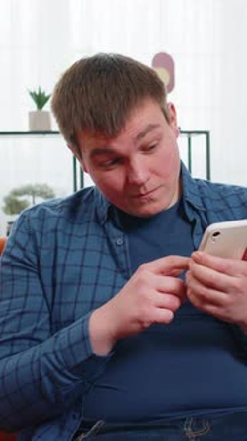 Man Indoors Using Mobile Phone Device Technology