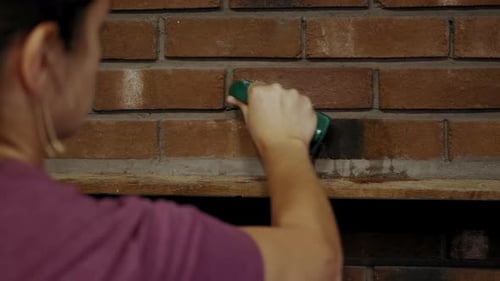 Close Up View of Woman Wiping Dust Using Cleaning Brush on Dirty Dusty Tile
