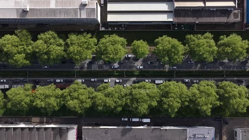 Aerial view of warehouses and factories and a tree lined road, Portugal.
