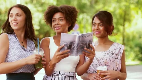 Tourism, Travel, Leisure, Holidays And Friendship Concept - Smiling Women With City Guide And Tak...