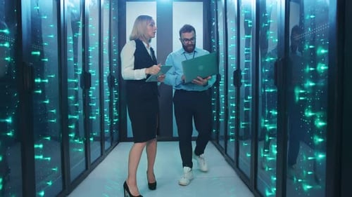 Data center technicians working in server room