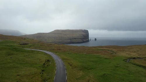 Aerial view of Drangarnir sea stacks in Faroe Islands landscape