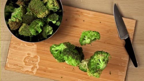 Broccoli Falls on the Board Filmed is Slow Motion 1000 Fps
