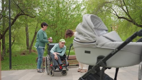 Children And Adults Sharing Park Moment Together Vibrant City Park Scene Showing Adults Aiding
