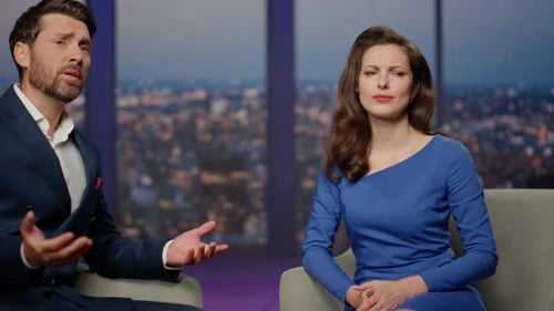 Anchor Woman Supporting Man Guest Telling Sad Life Story in Tv Show Studio