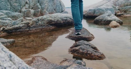 CloseUp Traveler Man Walks Along the River to Mountains