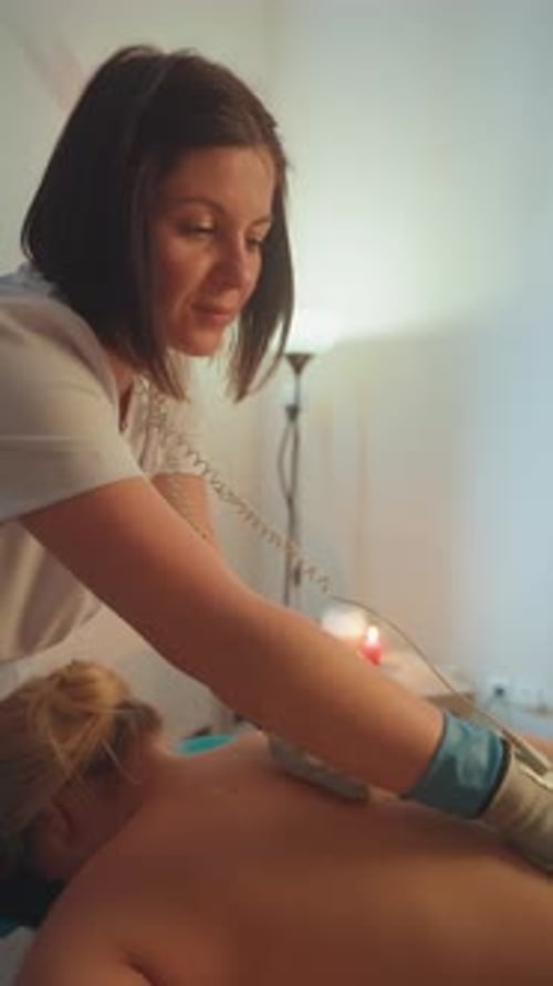 Calm Therapeutic Procedure with Candles and Soothing Ambient Lighting Warm and Tranquil Spa