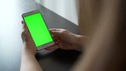 One Person Use Cellular Telephone with Touch Green Screen for Browsing Social