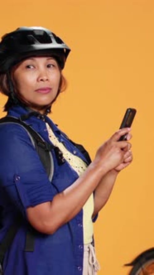 Woman with Bike Using Smart Phone