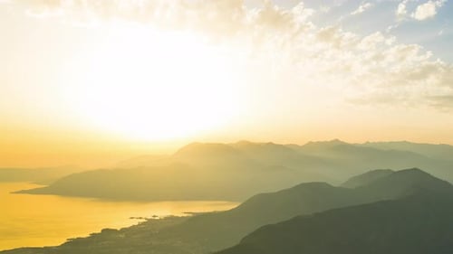 Hot Summer Sun Illuminates Shores of Adriatic Sea and Slopes of Montenegrin Mountains with Hotels in