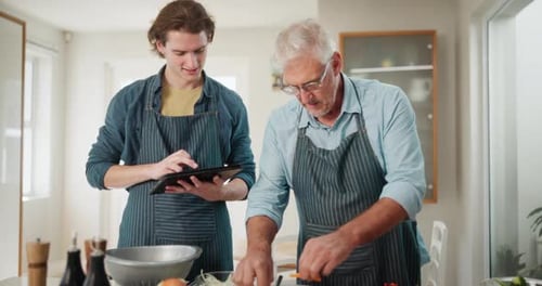 Cooking class, digital tablet and chef with senior man in kitchen for online recipe
