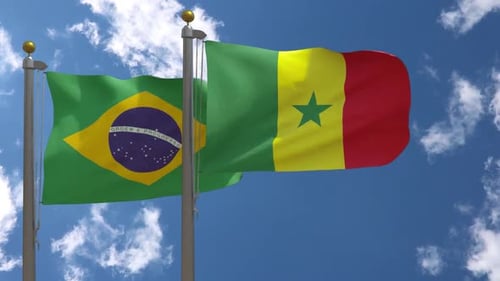 Brazil and Senegal National Flags Waving on Flagpoles