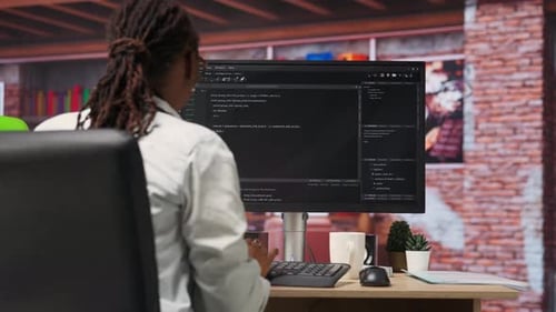 Programmer Types Code Into PC Entering Commands Running Script