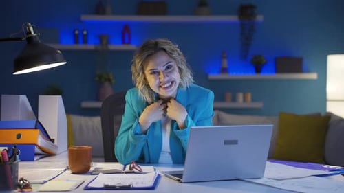 Home office worker woman talking motivationally to camera.