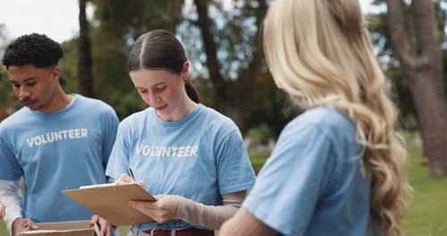 Volunteer, people and meeting with clipboard in park for community service, collaboration and plan