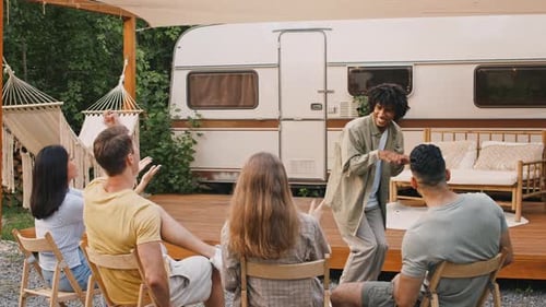 Friends Playing Charades on a Sunny Day Outdoors