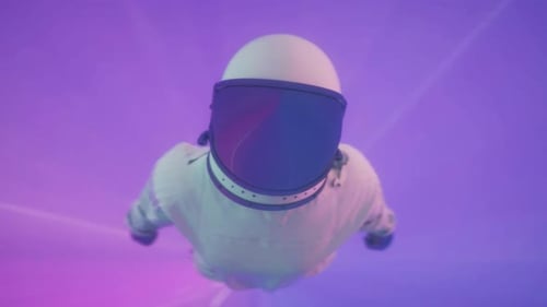 A man in a white space suit is flying through space. VJ loop for music video