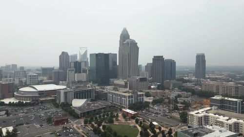 Aerial view of a vibrant urban skyline with skyscrapers and residential buildings.