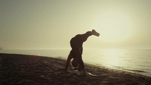 Active Sportswoman Practicing Yoga Pose Standing Beach at Sunrise. Flexible Woman Training