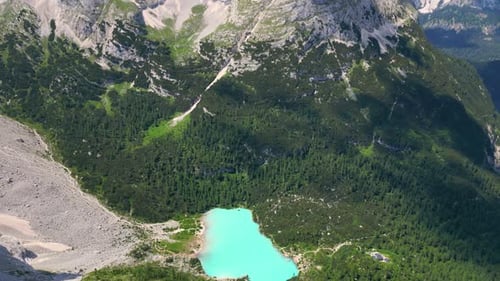 Aerial view of the blue turquoise Lake Sorapis, Lago di Sorapiss, with mountains with the background