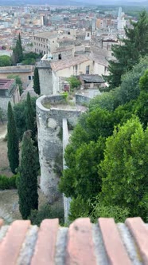 Serene Girona Cityscape from Archaeological Walk with Tower and Greenery