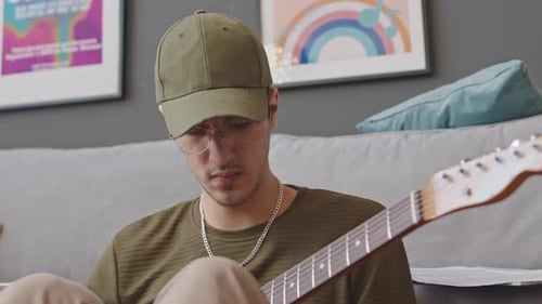 Young Adult Playing Electric Guitar