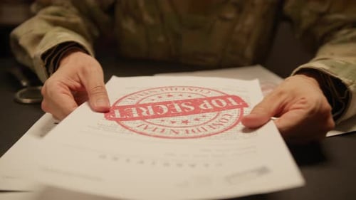 Flipping Through Top Secret Military Documents