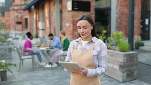 Waitress Taking Order on Tablet