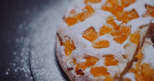 Orange Apple Pie with Powdered Sugar Close Up