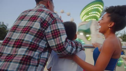 Family Enjoying the Carnival Atmosphere Together