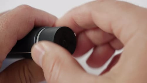 05sm. The ointment tube is opened by removing the protective film. Slow motion. Slow motion