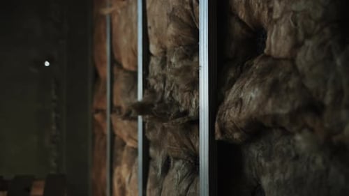 Close Up of Wall Insulation with Metal Studs