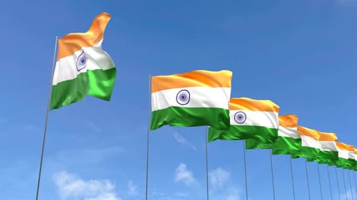 Realistic Indian Flags Waving Against a Clear Blue Sky