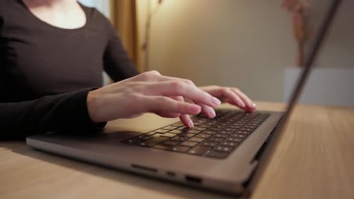 Woman Typing On Laptop - Working From Home. - close up shot
