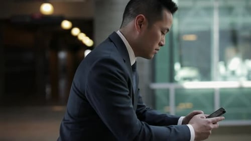 Portrait Businessman Using Smart Phone in Office Corridor 3539 Years