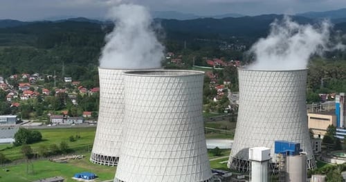 Aerial Drone Footage of a Large Coal Power Plant Station with Cooling Towers Chimney and Boiler
