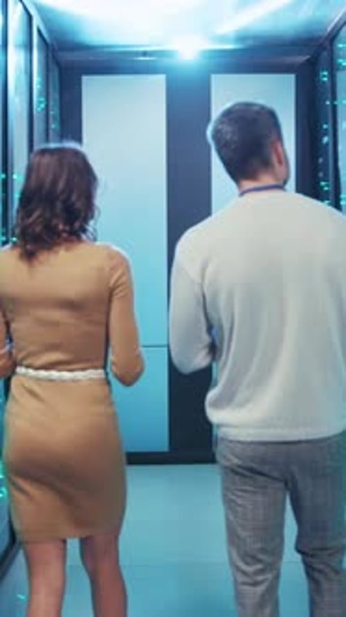 Server Room Professionals Talking, Man and Woman Working