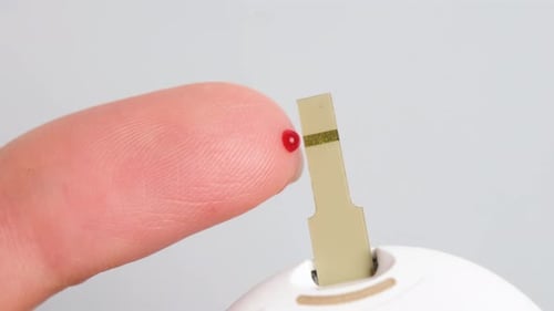 Close Up View on Woman Using Glucometer and Checking Blood Sugar Level Diabetes Concept Healthcare