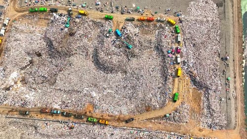 An aerial view over a landfill. 4K.
