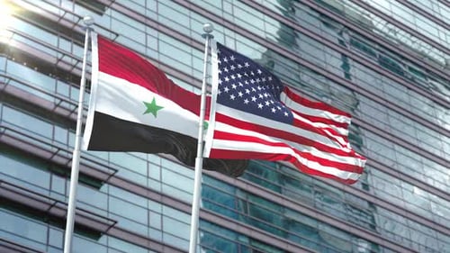 Syrian and American Flags Waving Before a Modern Building