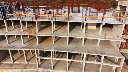 Aerial View of Unfinished Concrete Building Construction Site