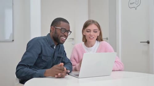 Smiling people on a video call using laptop