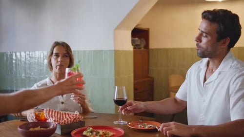 Dinning Friends Toasting Beverages at Cozy Cafe Closeup People Eating Lunch