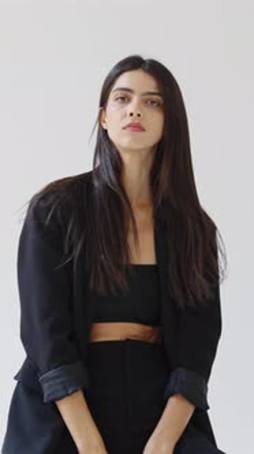 Elegant Woman Posing in Black Blazer in Studio