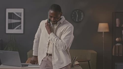 Adult Man Talking on Phone in Office