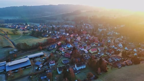 Village in Green Nature in the Hills Under the Rays of the Sun