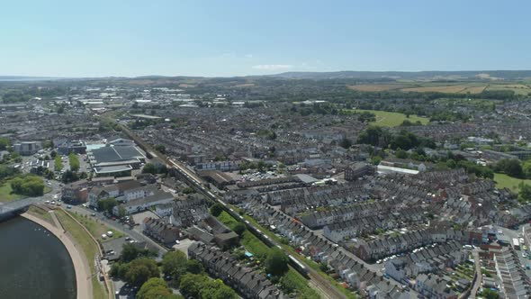 A train makes its way through the city of Exeter. Residential district ...