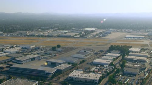 Aerial view of airport with airplanes and buildings