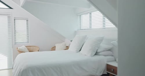 Empty bedroom, home and furniture for holiday, vacation and accommodation in hotel
