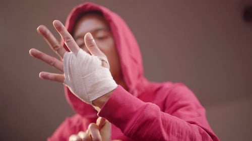 Adult Wrapping Hands with White Athletic Tape